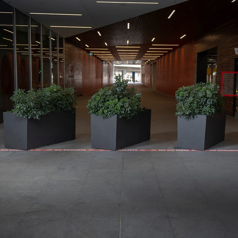 Architectural security planters installed at South Wharf DFO to restrict vehicle access in a pedestrian zone